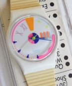 A Swatch watch in Port-O-Call pattern, original packaging, new battery within box.