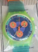 A Chrono Swatch watch in Neo Wave pattern, part packaging, new battery within bag.