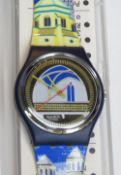 A Swatch watch in Back Stage pattern, incorrect packaging, new battery within box.