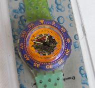 A Scuba 200 Swatch watch in Hyppocampus pattern, part packaging, new battery within box.