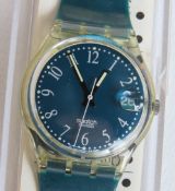 A Swatch watch in Grune Lui pattern, original packaging, new battery within box.