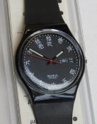 A Swatch watch in Genji pattern, original packaging, new battery within box.