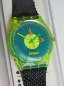 A Swatch watch in Champ pattern, original packaging, new battery within box.