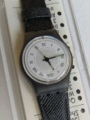 A Swatch watch in Debutante pattern, original packaging, new battery within box.