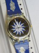 A Swatch watch in Anchorage pattern, original packaging, new battery within box.