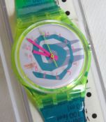 A Swatch watch in Bikini pattern, incorrect packaging, new battery within box.