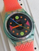 A Swatch watch in Tour pattern, original packaging, new battery within box.