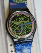 A Swatch watch in The Globe pattern, original packaging, new battery within box.
