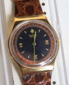 A Swatch watch in PDE pattern, original packaging, new battery within box.