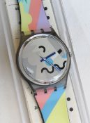 A Swatch watch in Cosmesis pattern, original packaging, new battery within box.