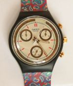 A Chrono Swatch watch in Orologio pattern, original packaging, new battery within bag.