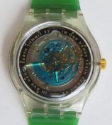 An automatic Swatch watch in Earth Summit '92 pattern, within original packaging.