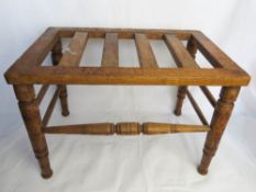 A hotel style luggage stand.