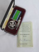 A Battle for Britain commemorative medal with paperwork signed by Air Marshal Sir Ivor Broom.