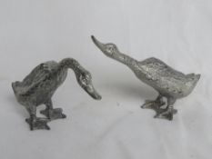 A pair of silver plated geese table decorations, approx 6.5cm high.