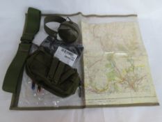 A quantity of militaria including ear defenders, map, socks, etc.