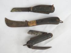 Two boot jack knives with black handles, together with another folding knife. Three items.