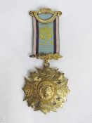 A hallmarked silver gilt Royal Antediluvian Order of Buffaloes (RAOB) medal with ribbon, made by L.