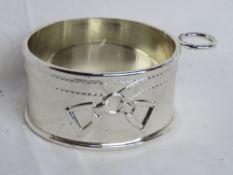 A silver plated wine bottle coaster having horse stirrup design upon.