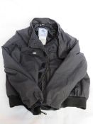 A Quarterdeck Collection utility jacket size X-Large.