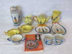 A quantity of Quimper pottery including tea pot, vase, jugs, dishes, porringers etc.