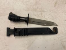 A British SA80 bayonet and scabbard.