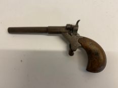 An antique Velo pistol with original woo
