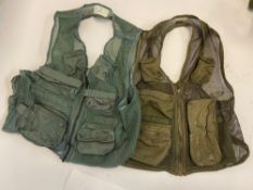 Two military survival vests, one with fa