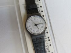 A Swatch watch in Debutante pattern, original packaging, new battery within box.