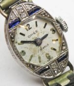 A delightful Art Deco platinum diamond and sapphire ladies cocktail watch,