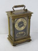 A brass H Samuel eight day, three glass carriage clock.