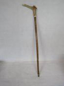 A mid 20th century Whistle walking stick, the antler handle with brass end cap.