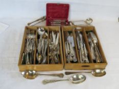 A quantity of silver plated cutlery including set of lobster picks, sugar tongs, serving spoons,