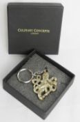An as new in box Culinary Concepts octopus pattern keychain.