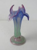 A hand blown Art Glass vase in the form of a flower standing 21cm high.