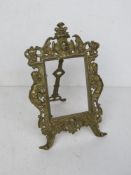 A brass easel back picture frame standing 25.5cm high, no glass.