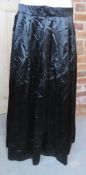 A black silken Belle Epoque style skirt.