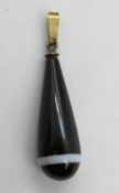 A bulls eye agate pendant.