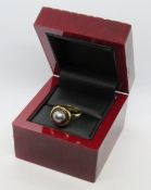 A hallmarked 18ct gold and blue pearl ring, 8mm dia pearl, 8.6g. In light up box.