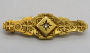A 9ct gold brooch having Chester hallmark, diamond to centre, 3.7cm wide, 1.5g.
