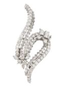 A diamond spray brooch, modelled as a scrolled ribbon of graduated round brilliant, baguette and