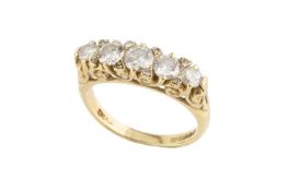 A diamond five stone ring, the graduated round brilliant-cut diamonds spaced by smaller single and