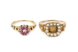 A gem set cluster ring, designed as a flowerhead cluster of cushion-shaped rubies and red stones,