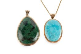 Two hardstone pendants, each yellow precious metal mounted, accompanied by a curb-link chain stamped