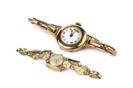A lady's 9ct gold cased bracelet watch, the circular white enamel dial with black and blue Roman