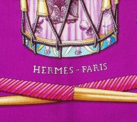 A 'Les Tambours' silk scarf by Hermès, designed by Joachim Metz, depicting a cluster of battalion