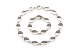 A silver collar necklace and bracelet suite designed by Flemming Eskildsen for Georg Jensen, each