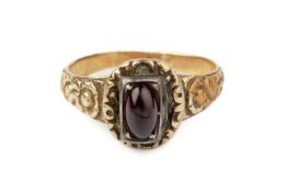 A 19th century single stone ring, centred with an oval cabochon red stone in closed-back setting, to