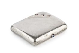 An early 20th century planished silver cigarette case, the cover decorated with three gem set