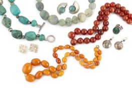 A collection of jewellery, comprising an amber bead necklace, the single stand of amber beads